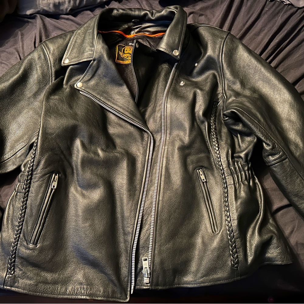 Women’s heavy leather riding jacket. New without tags fits like a woman’s 2XL